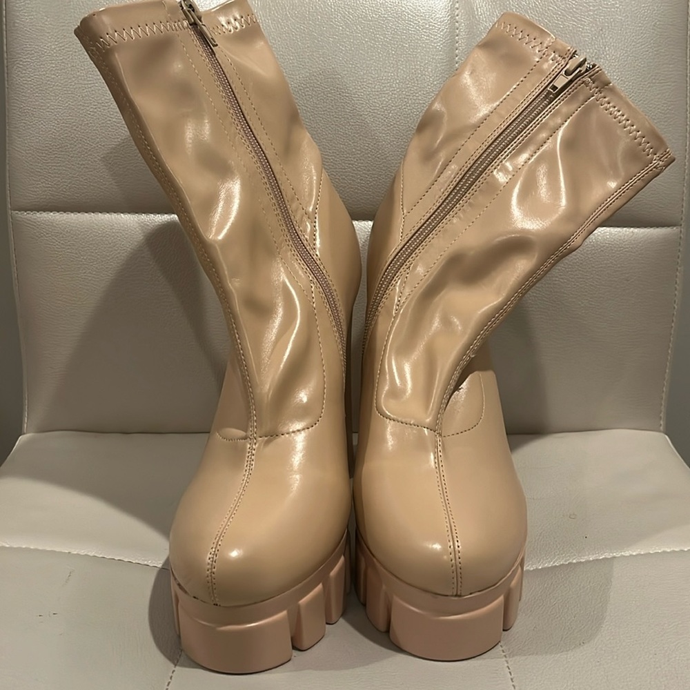 Women’s high heel boots. Size 8, nude color with inside zipper.